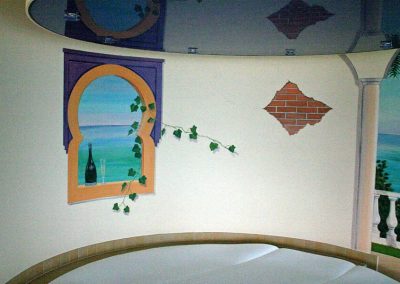 muurschildering van raam in ronde wand
